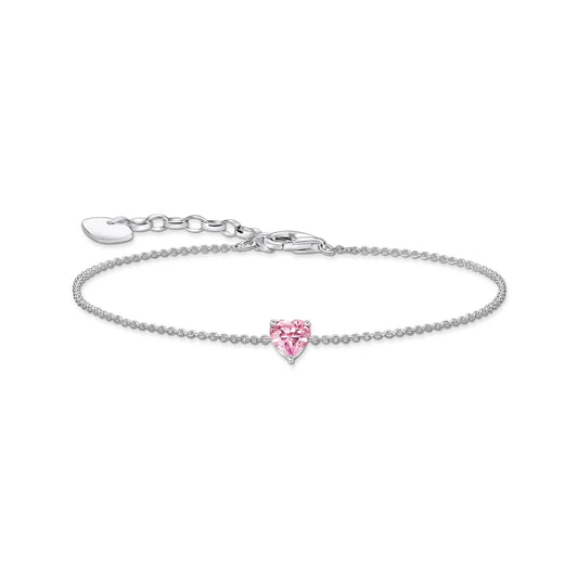 Silver bracelet with a pink heart-shaped charm on a white background
